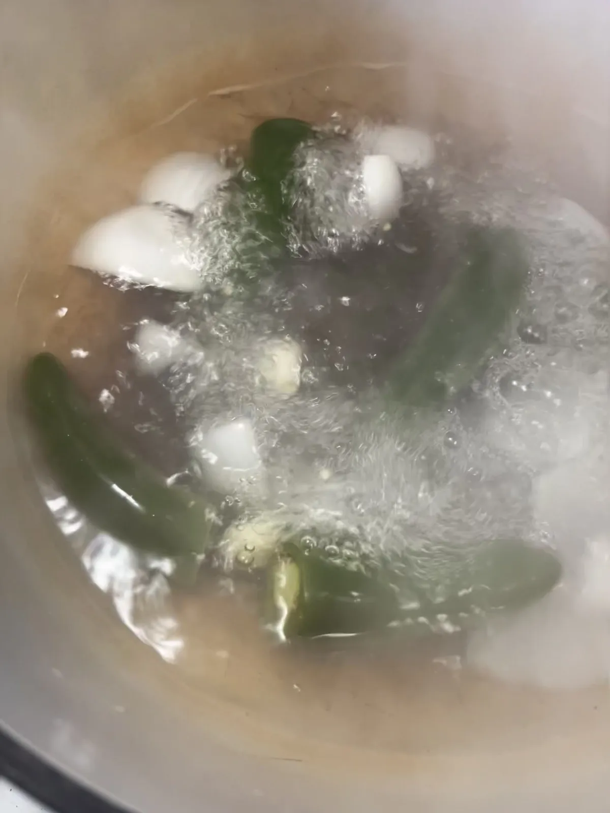 Jalapenos and onion at full boil in a pot